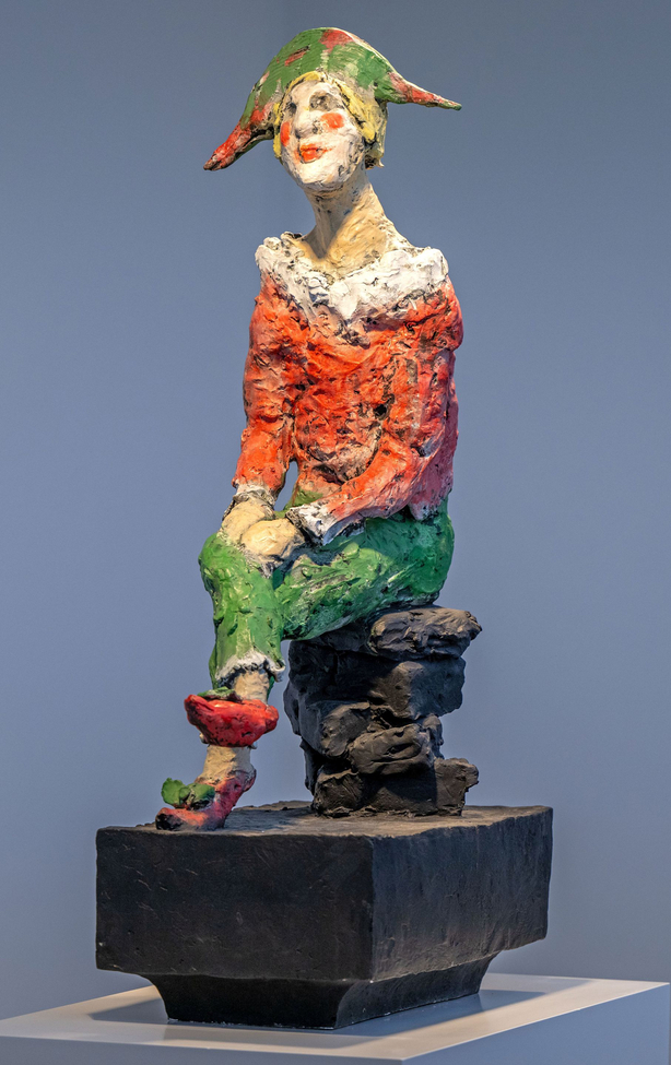 Harlekin auf dem Stuhl
